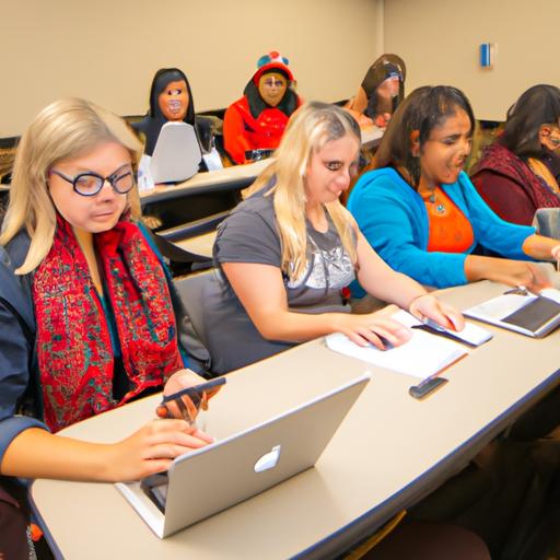 Một nhóm sinh viên tại một trường đại học ở Mỹ ngồi trong một lớp học với các laptop và sổ tay.