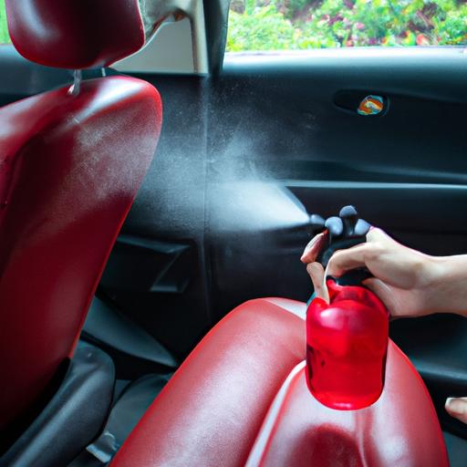 Tay người dùng xịt nước hoa ô tô lên ghế xe hơi